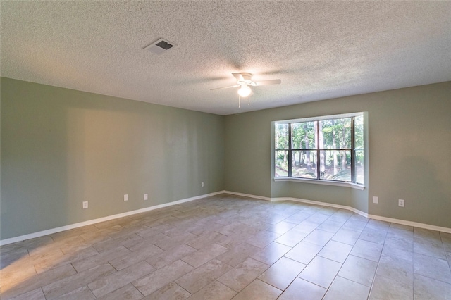 15823 Stagecoach Rd, Stagecoach, TX 77355 - unfurnished room with ceiling fan and a textured ceiling