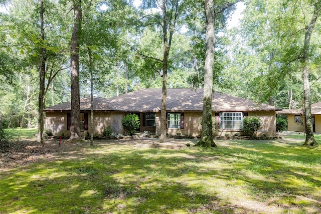 15823 Stagecoach Rd, Stagecoach, TX 77355 - view of front of property featuring a front lawn and a shingled roof