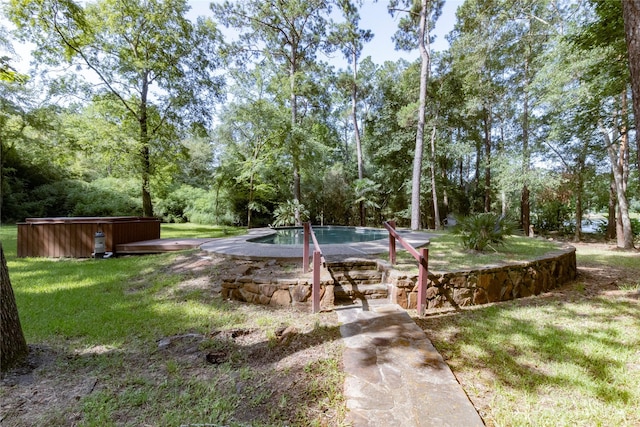 15823 Stagecoach Rd, Stagecoach, TX 77355 - view of grassy yard featuring a jacuzzi, an outdoor pool, and view of wooded area