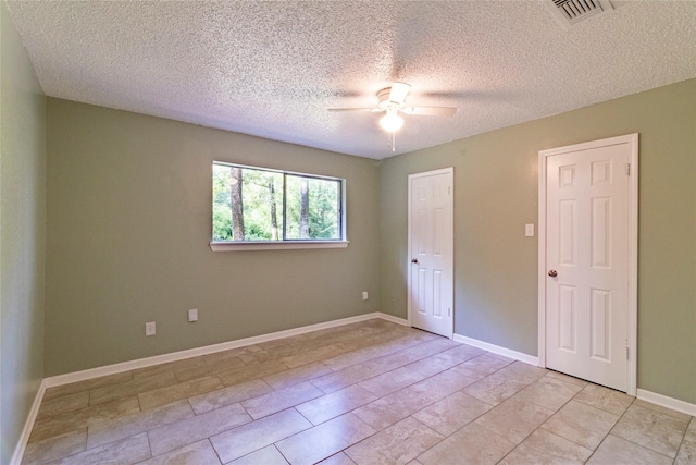 15823 Stagecoach Rd, Stagecoach, TX 77355 - empty room with a ceiling fan and a textured ceiling