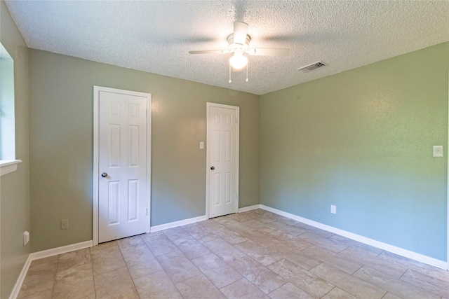 15823 Stagecoach Rd, Stagecoach, TX 77355 - empty room featuring ceiling fan and a textured ceiling