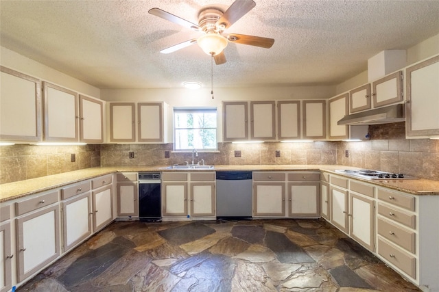 15823 Stagecoach Rd, Stagecoach, TX 77355 - kitchen with dishwasher, under cabinet range hood, cooktop, a textured ceiling, and stone floors