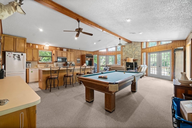 31 N Lakeview Dr, Point Blank, TX 77364 - playroom with ceiling fan, light carpet, french doors, wood walls, and billiards table