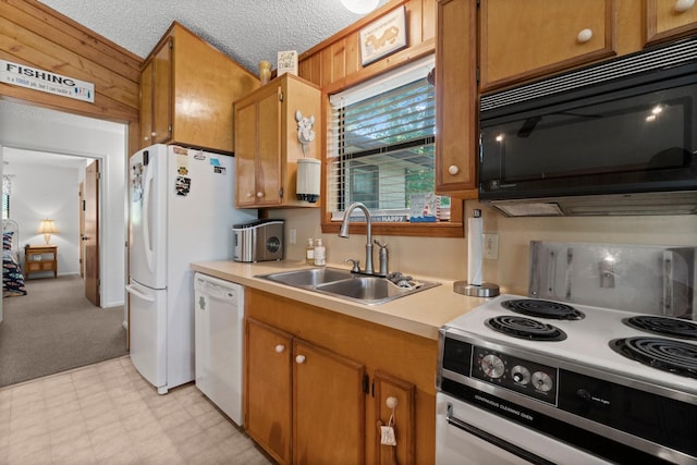 31 N Lakeview Dr, Point Blank, TX 77364 - kitchen featuring black microwave, electric stove, white dishwasher, light countertops, and wooden walls