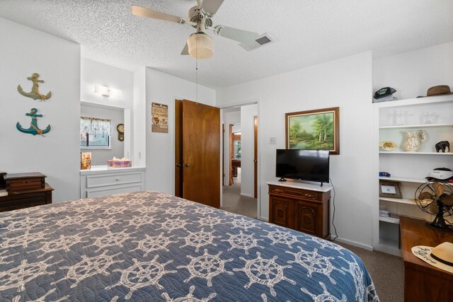 31 N Lakeview Dr, Point Blank, TX 77364 - carpeted bedroom with a textured ceiling and a ceiling fan