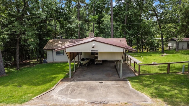 31 N Lakeview Dr, Point Blank, TX 77364 - view of front of property with concrete driveway, a carport, a chimney, and view of wooded area