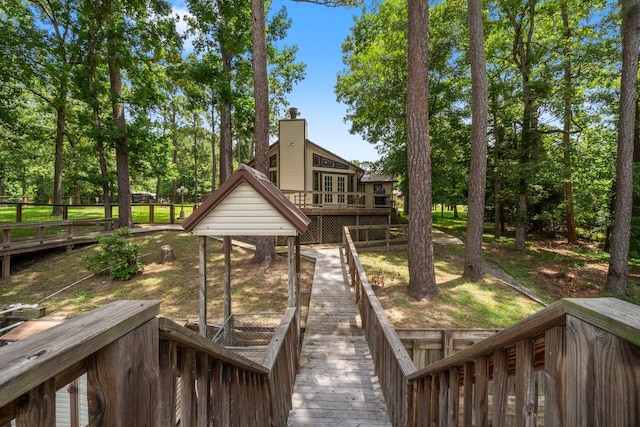 31 N Lakeview Dr, Point Blank, TX 77364 - back of house with a wooden deck and a chimney