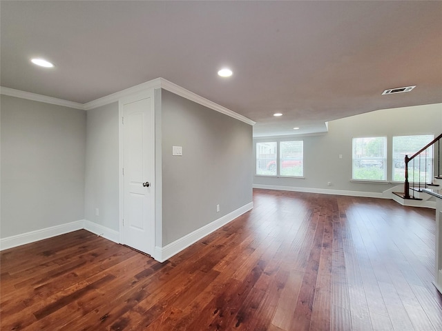 2608 Arlington St, Houston, TX 77008 - spare room with stairway, ornamental molding, dark wood-type flooring, and recessed lighting