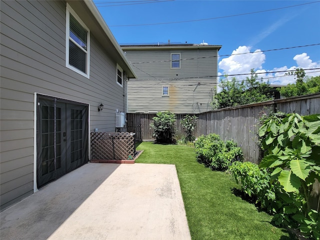 2608 Arlington St, Houston, TX 77008 - fenced backyard with french doors and a patio area