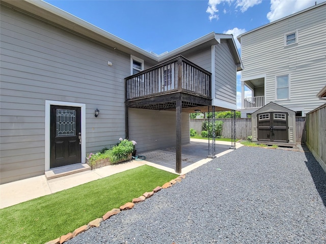 2608 Arlington St, Houston, TX 77008 - view of side of home with a fenced backyard, a storage shed, and a patio