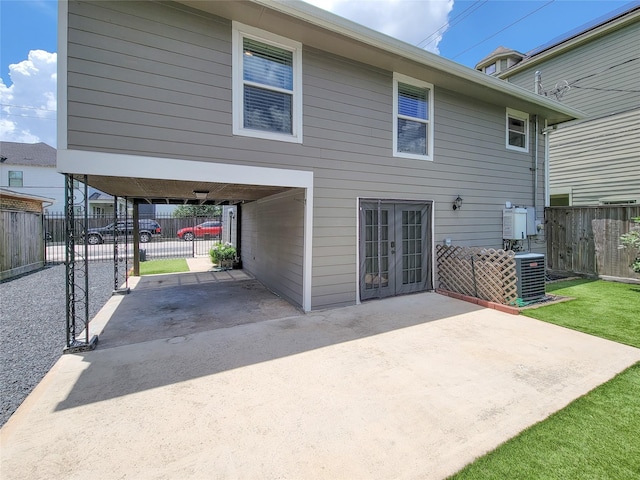 2608 Arlington St, Houston, TX 77008 - back of property featuring french doors, a gate, a patio, and a carport