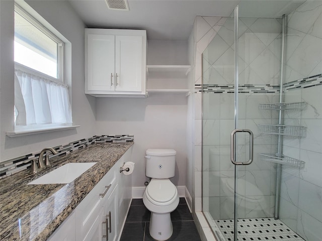 2608 Arlington St, Houston, TX 77008 - bathroom featuring a shower stall, vanity, and tile patterned flooring