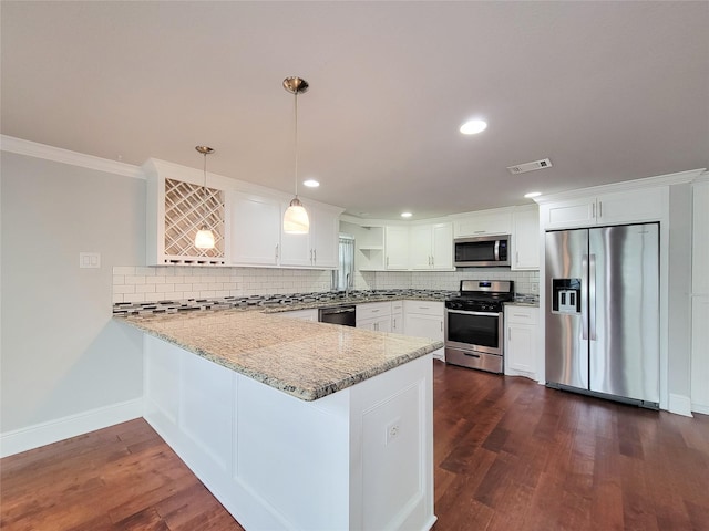 2608 Arlington St, Houston, TX 77008 - kitchen featuring appliances with stainless steel finishes, a peninsula, tasteful backsplash, crown molding, and dark wood-style flooring