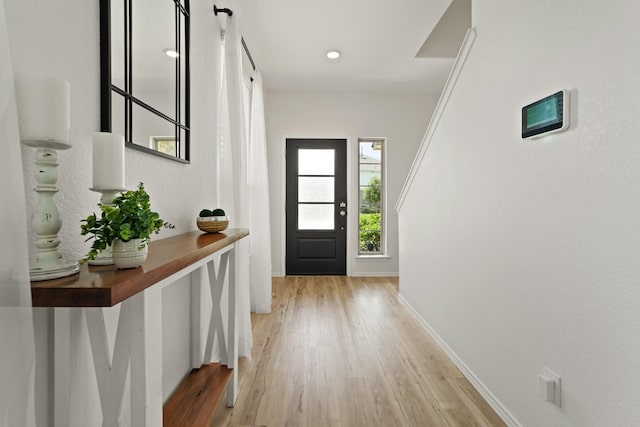 18402 Hilltop Climb Dr, Hockley, TX 77447 - foyer entrance featuring light wood-style flooring and baseboards