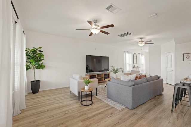 18402 Hilltop Climb Dr, Hockley, TX 77447 - living area with ceiling fan and light wood-style floors