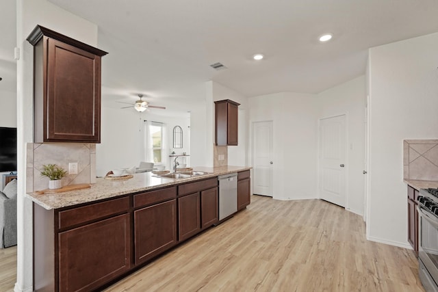 18402 Hilltop Climb Dr, Hockley, TX 77447 - kitchen featuring stainless steel appliances, light wood-type flooring, dark brown cabinets, ceiling fan, and recessed lighting