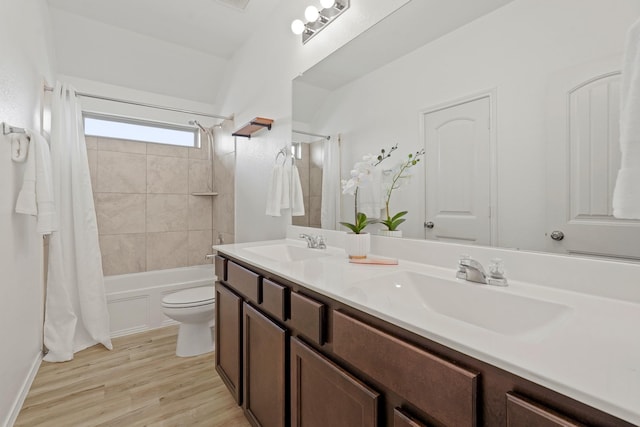 18402 Hilltop Climb Dr, Hockley, TX 77447 - full bath featuring double vanity, shower / bath combination with curtain, and wood finished floors