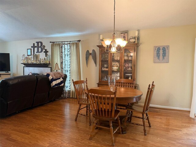 343 Lake View Dr, Montgomery, TX 77356 - dining area with wood finished floors and a chandelier