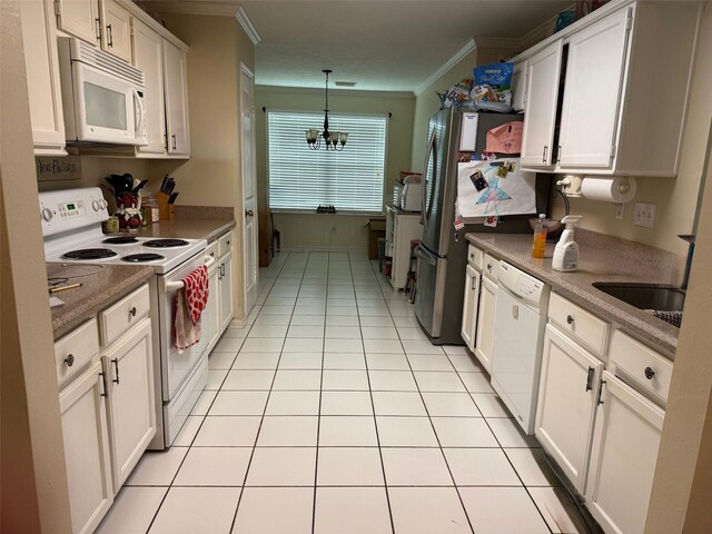 343 Lake View Dr, Montgomery, TX 77356 - kitchen featuring white appliances, crown molding, white cabinets, a chandelier, and light tile patterned floors