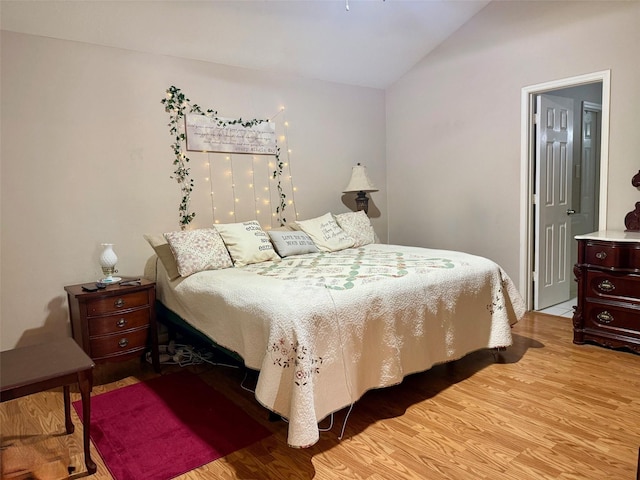 343 Lake View Dr, Montgomery, TX 77356 - bedroom featuring vaulted ceiling and light wood-style flooring