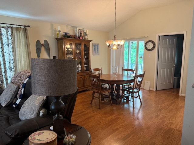 343 Lake View Dr, Montgomery, TX 77356 - dining room with light wood-type flooring, vaulted ceiling, and a chandelier