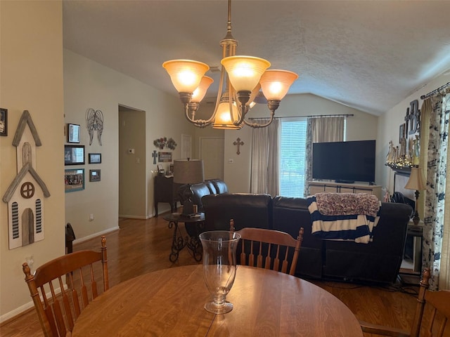 343 Lake View Dr, Montgomery, TX 77356 - dining space featuring lofted ceiling, a chandelier, wood finished floors, and a textured ceiling