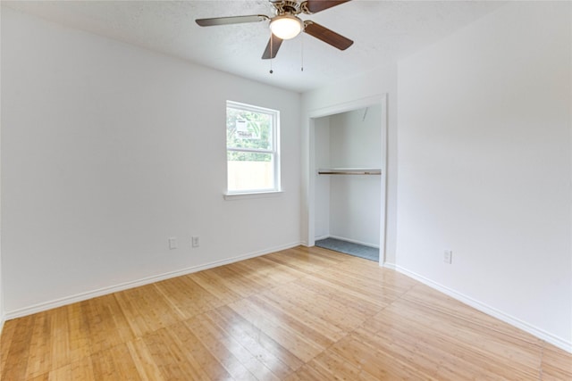 7535 Roaring Springs Dr, Houston, TX 77064 - unfurnished bedroom featuring light wood-type flooring, a closet, and ceiling fan