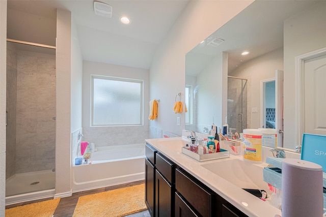 4315 Isoletta Ct, Katy, TX 77449 - full bathroom featuring a shower stall, a bath, double vanity, wood finished floors, and recessed lighting