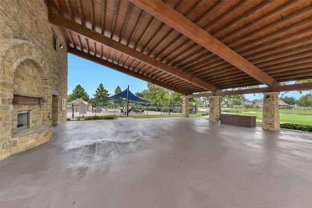 3030 Rabbit Brush Ln, Manvel, TX 77578 - view of patio / terrace with an outdoor stone fireplace