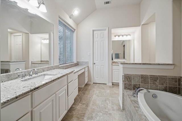 3030 Rabbit Brush Ln, Manvel, TX 77578 - full bath with vaulted ceiling, two vanities, and a bath