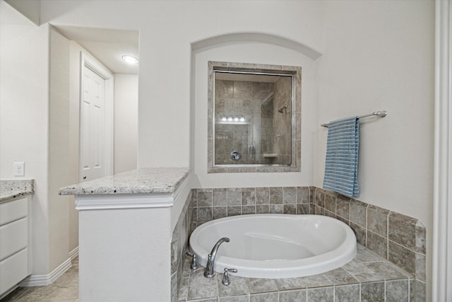 3030 Rabbit Brush Ln, Manvel, TX 77578 - full bath with vanity, a bath, and a tile shower