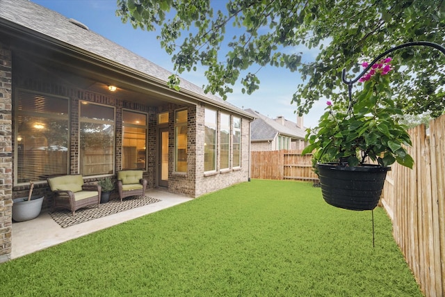 3030 Rabbit Brush Ln, Manvel, TX 77578 - fenced backyard with a patio area