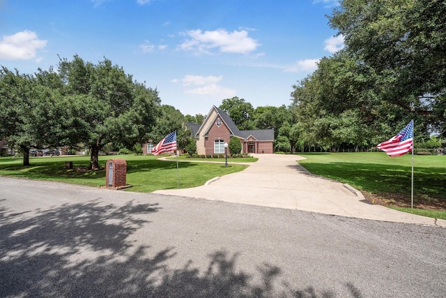3610 Pembrooke Dr, Richmond, TX 77406 - view of front of house featuring a front yard, concrete driveway, and a garage