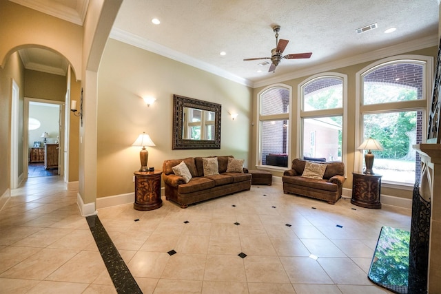 3610 Pembrooke Dr, Richmond, TX 77406 - living room with arched walkways, ceiling fan, recessed lighting, light tile patterned floors, and ornamental molding