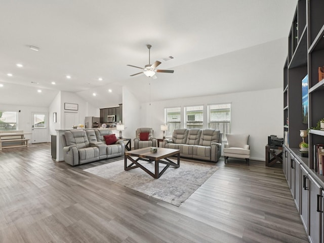 16129 Dockside St, Crosby, TX 77532 - living room with lofted ceiling, healthy amount of natural light, a ceiling fan, wood finished floors, and recessed lighting