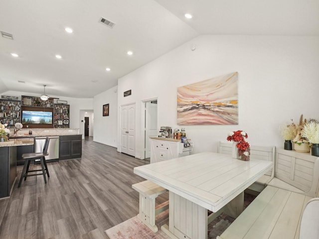 16129 Dockside St, Crosby, TX 77532 - dining area with lofted ceiling, recessed lighting, and wood finished floors