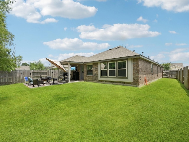 16129 Dockside St, Crosby, TX 77532 - rear view of property featuring brick siding, a fenced backyard, a patio, and a shingled roof
