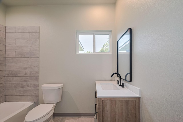 1909 Oregon St, Baytown, TX 77520 - bathroom featuring vanity, bathing tub / shower combination, and wood finished floors