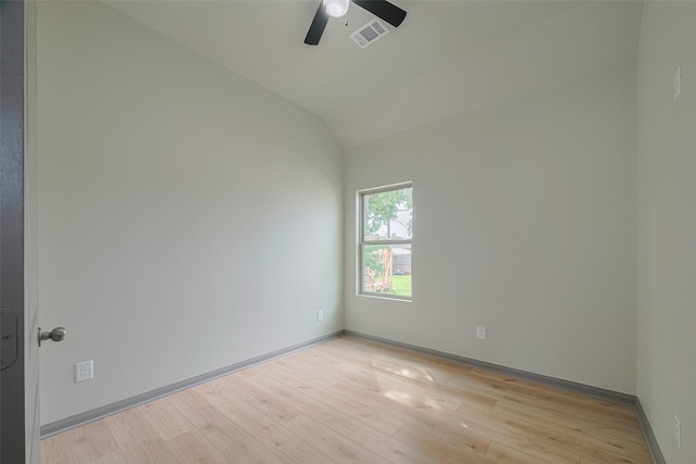 1909 Oregon St, Baytown, TX 77520 - spare room with a ceiling fan, light wood-type flooring, and vaulted ceiling