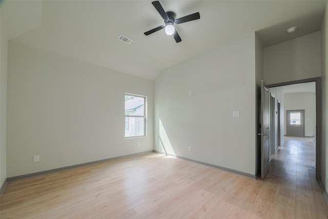 1909 Oregon St, Baytown, TX 77520 - unfurnished room featuring lofted ceiling, a ceiling fan, light wood-style floors, and a smoke detector