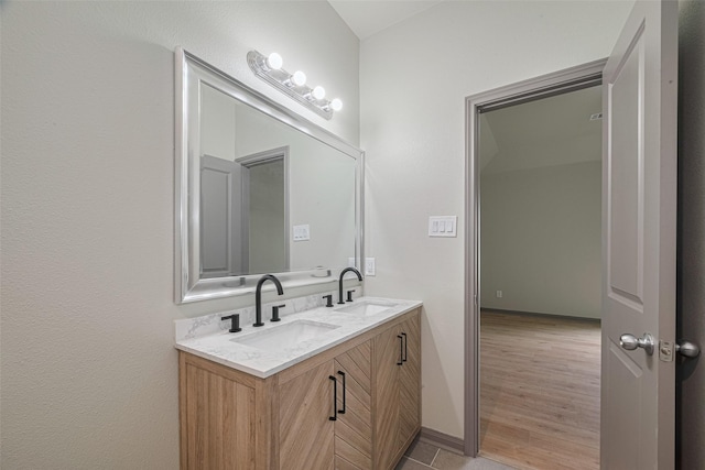1909 Oregon St, Baytown, TX 77520 - full bathroom featuring double vanity and baseboards