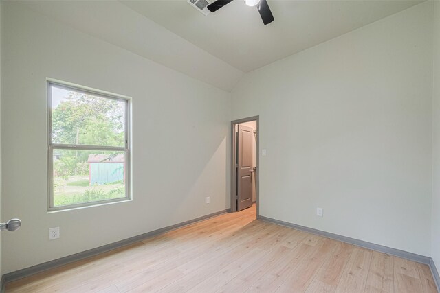 1909 Oregon St, Baytown, TX 77520 - spare room featuring a ceiling fan, light wood-style flooring, and lofted ceiling
