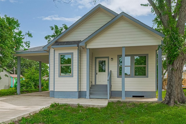 1909 Oregon St, Baytown, TX 77520 - view of front of house featuring concrete driveway, entry steps, roof with shingles, and a carport