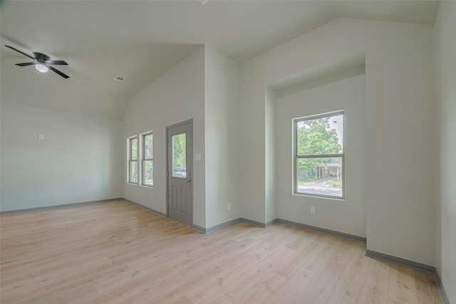 1909 Oregon St, Baytown, TX 77520 - empty room featuring lofted ceiling, healthy amount of natural light, light wood-type flooring, and ceiling fan