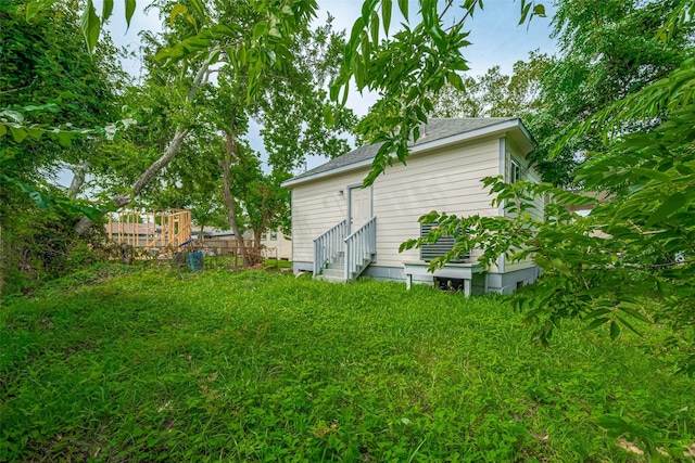 1909 Oregon St, Baytown, TX 77520 - view of yard with entry steps and a deck