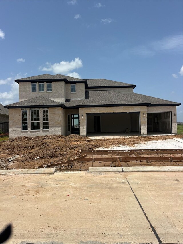 5339 Acapulco Mist Dr, Katy, TX 77493 - view of front of property featuring a garage, a shingled roof, and driveway