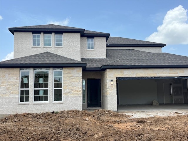 5339 Acapulco Mist Dr, Katy, TX 77493 - view of front of house with roof with shingles, stone siding, and a garage