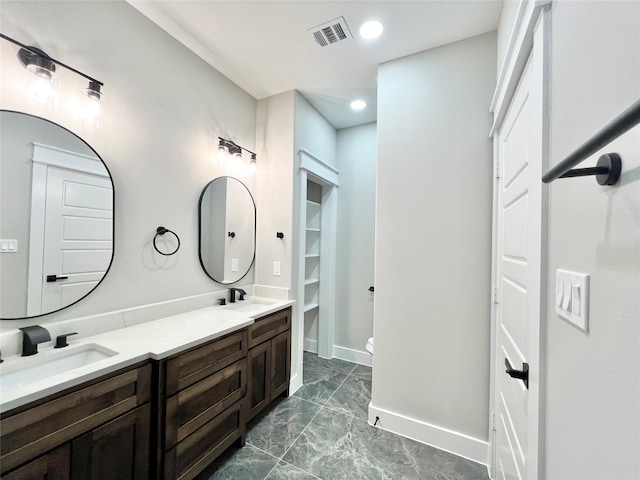 11841 12th St, Santa Fe, TX 77510 - full bath featuring marble look tile flooring, double vanity, and recessed lighting