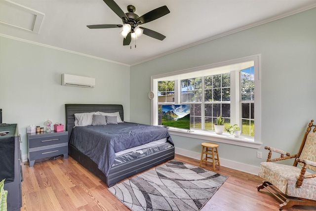 864 N Franklin St, La Grange, TX 78945 - bedroom with a wall mounted air conditioner, light wood-style flooring, crown molding, attic access, and a ceiling fan
