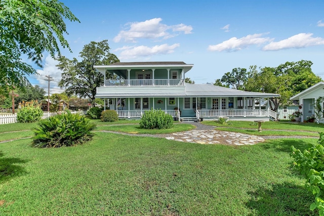864 N Franklin St, La Grange, TX 78945 - back of property with covered porch and a lawn